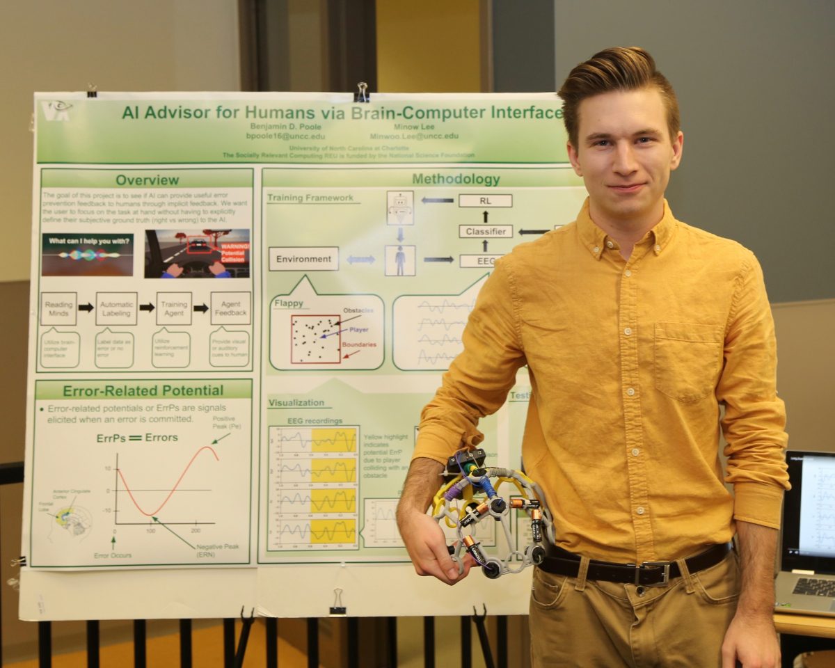 Benjamin Poole with Presentation Poster